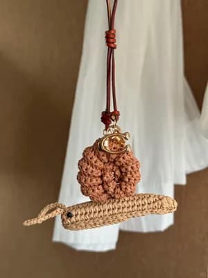 Raffia Snail Bag Charm — free crochet pattern